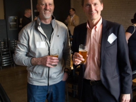 Members socialize as they partake in refreshments provided by Good City Brewing.