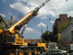 Floor sections are lifted into place at the development at 1530 N. Jackson St.