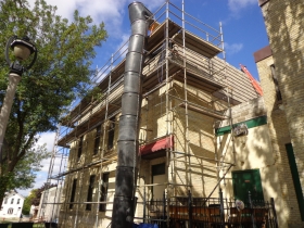 Fixing the roof of Points East Pub. Photo by Michael Horne.