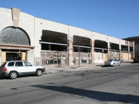 Construction at the former Prospect Mall as the auto dealership turned mall is being converted to a mixed-use apartment building.
