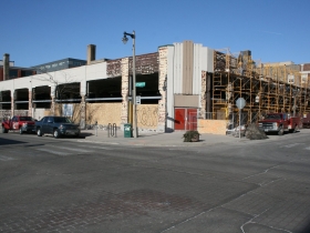 Construction at the former Prospect Mall as the auto dealership turned mall is being converted to a mixed-use apartment building.
