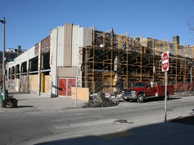 Construction at the former Prospect Mall as the auto dealership turned mall is being converted to a mixed-use apartment building.