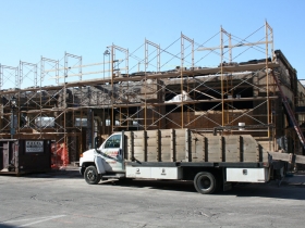 Construction at the former Prospect Mall as the auto dealership turned mall is being converted to a mixed-use apartment building.