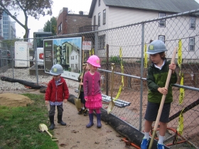 The junior construction brigade wields the coveted Golden Shovels at the groundbreaking event for Sage on Jackson.