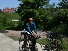Ald. Kovac arrives in style, by bike.