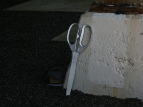 The silver scissors await use.