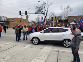 Members of the Trump rally block traffic
