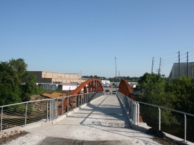 A bridge behind Palermo's takes you in to Three Bridges Park.