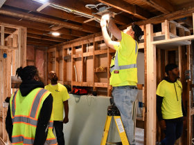 Ezekiel Workers Install Light Fixtures