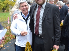Former Milwaukee County Parks Director, Sue Black, celebrates her efforts to make the football field a reality in the company of 3rd District Alderman, Nik Kovac