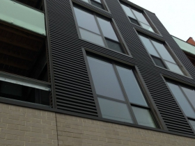 The notch above the top balcony was a design change that came out of the ARB process.