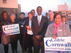 Supporters catch some needed sunlight on the penthouse deck of the Diamond Tower, 1633 N. Prospect Ave. at a fundraising event for judicial candidate Cedric Cornwall hosted by residents Jim Carpenter and Eldeen Carpenter, Thursday, March 20th, 2014.