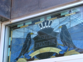 Stained glass sign above door.
