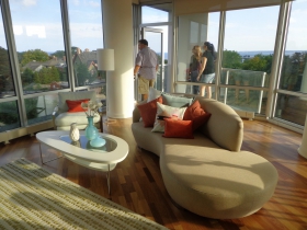 There is a small deck connected to the living room.