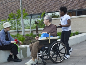 Girl from Our Next Generation with residents