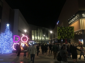 Fans walk though DoCo plaza to arena.