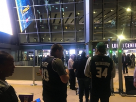 05-sac-kings-fan-in-a-bibby-jersey-bucks-fan-in-a-antetokounmpo-jersey-waiting-to-go-inside