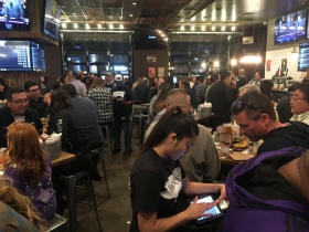 Servers take orders at Sauced BBQ before the Bucks vs Kings game.
