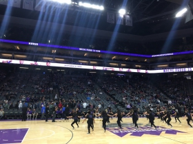 A local high school dance team performs during halftime.