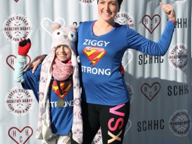 Lola and Morgan Zyszkiewicz pose for photos at the finish line of the Steve Cullen Healthy Heart Run/Walk