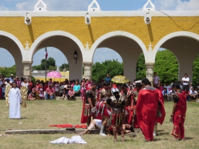 Roman soldiers prepare to nail Jesus to the cross in the San Antonio convent courtyard passion play