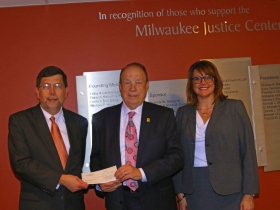 MBA Foundation President Francis W. Deisinger with Attorney Michael Hupy, and Mary Ferwerda, executive director of  the Milwaukee Justice Center.