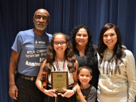 Tony with a “Tony Lucas Award” winner and family. MYSO established an award in honor of Tony’s service to the program.