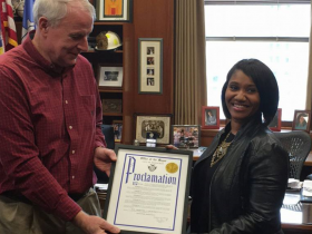 Ms. Hall receives an official proclamation from Mayor Tom Barrett in Milwaukee's City Hall
