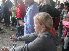 She is waiting to bike the Kinnickinnic River Trail.