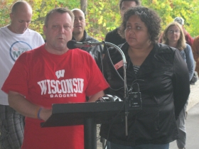 Josh Zepnick, with JoCasta Zamarripa to his left, speaking about the Kinnickinnic River Trail.
