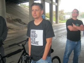 Bicyclists sporting a Milwaukee Home T-Shirt waits to ride the new trail.