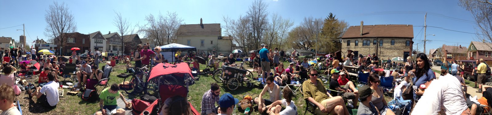 Panoramic view of bicyclists waiting to register for the Riverwest 24.