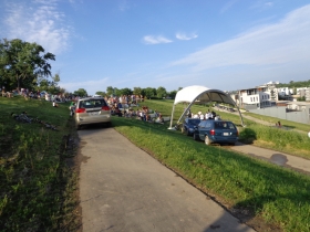 Vehicles delivering musical equipment and sound gear leave scars along the bicycle pedestrian trail. Perhaps cargo bicycles could be used instead.