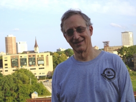 Tom Schneider, the head of COA since 2001 strolls through the crowd in his best camp director fashion.
