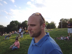 Ald. Nik Kovac walks through the concert site.