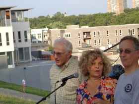 Leon Joseph listens while his wife Bonnie delivers some one-liners to the amusement of Tom Schneider.