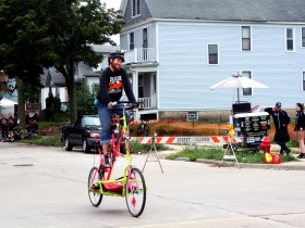 Steve Roche riding a tall bike.