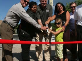Alderman Nik Kovac, Alderwoman Milele Coggs, Mayor Tom Barrett, and Gina Gruenwald at the Pleasant Street Lift Bridge ribbon cutting.