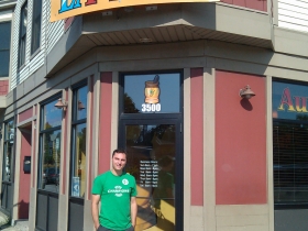Dan is standing in front of 3500 National Avenue - Layton Boulevard West Neighbors renovated that building from a liquor store to a Mexican restaurant on the lower level and two apartments on the upper level.