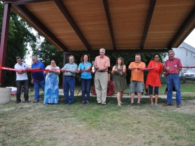 Arlington Heights Park Bandshell Ribbon Cutting. L-R: Natanael Martinez, Layton Boulevard West Neighbors; Mike DeHays, Silver City Resident; Vanessa Llanas, City of Milwaukee Neighborhood Improvement Development Corporation; Leo Ries, LISC Milwaukee; County Chairwoman Marina Dimitrijevic; Milwaukee Mayor Tom Barrett; Charlotte John-Gomez, Layton Boulevard West Neighbors; State Representative Josh Zepnick; Jezamil Vega-Skeels, LBWN; Richard Schalk