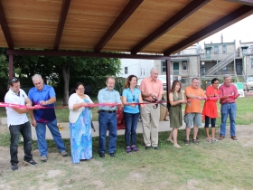 Arlington Heights Park Bandshell Ribbon Cutting. L-R: Natanael Martinez, Layton Boulevard West Neighbors; Mike DeHays, Silver City Resident; Vanessa Llanas, City of Milwaukee Neighborhood Improvement Development Corporation; Leo Ries, LISC Milwaukee; County Chairwoman Marina Dimitrijevic; Milwaukee Mayor Tom Barrett; Charlotte John-Gomez, Layton Boulevard West Neighbors; State Representative Josh Zepnick; Jezamil Vega-Skeels, LBWN; Richard Schalk.