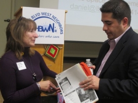 Charlotte John-Gomez, executive director of LBWN, speaks with Ivan Gamboa, vice president of Tri-City National Bank, about LBWN’s Quality of Life Plan.