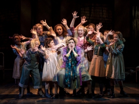 Carrie Hitchcock, center (Miss Hannigan) performs with the SKY cast in rehearsal for Skylight Music Theatre’s production of Annie running November 17 through December 27.