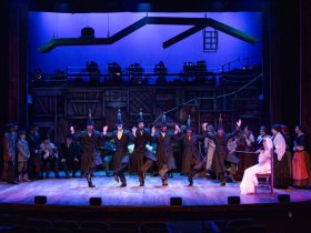 (I. to r.) Peter Neugent (Bottle Dancer), Grayson Buesing (Bottle Dancer), Nate Rodriguez (Bottle Dancer), Thom Cauley (Bottle Dancer), Alyssa Tyson (Bottle Dancer), and Emme Buesing (Bottle Dancer) and cast in Skylight Music Theatre’s production of Fiddler on the Roof running October 3-26, 2025.