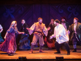 (l. to r.) Seth K. Hale (Clopin, center) and the cast in Skylight Music Theatre’s production of The Hunchback of Notre Dame running May 20 – June 12, 2022.
