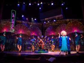 Karl Hall (Ensemble) and Ray Jivoff (Albin) with the Cagelles in Skylight Music Theatre’s La Cage Aux Folles.