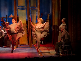 (l. to r.) Stephanie Staszack (Slim) and Christal Wagner (Gertie Cummings) dance for the cast of Skylight Music Theatre’s production of Oklahoma! September 27 – October 13.