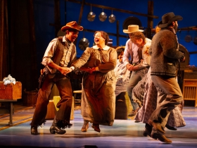 Sean Anthony Jackson (Will Parker) and SaraLynn Evenson (Kate), center, in Skylight Music Theatre’s production of Oklahoma! September 27 – October 13.