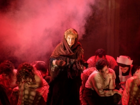 Susan Spencer (Center, Beggar Woman) surrounded by cast of Skylight Music Theatre’s Sweeney Todd running May 19 – June 11.