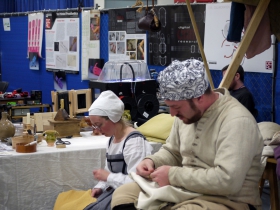 Foreground: Tailors with Old England Grown New. Background: 3D Printer from UW-Milwaukee’s Digital Craft Research Lab